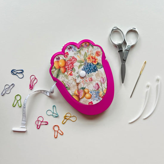 Decorative crocheting kit with floral design on a white background