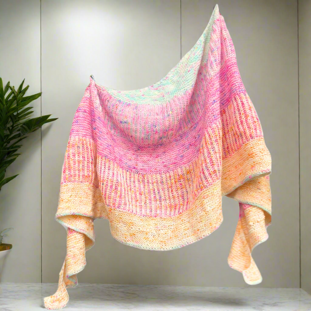 Multicolored knitted shawl on a white background